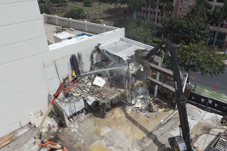 An aeriel view of the demolition and spraying process of the former Physical Therapy and Occupational Therapy Health Services building.