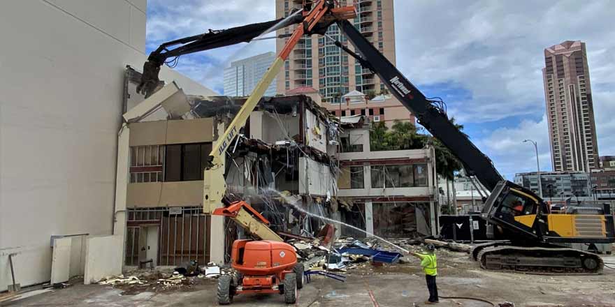 Construction crews demolish the building at 800 S. King St., the former location of Straub’s Physical Therapy and Occupational Health services, in May 2023.