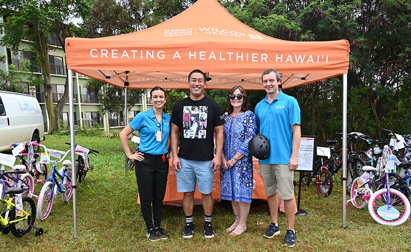 Group of caregivers and community leaders at Keiki Bike Safety day.