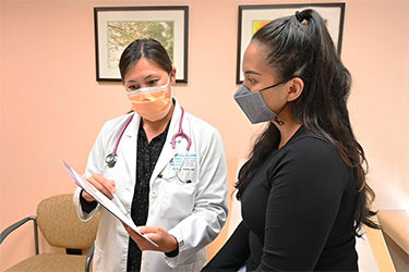 Dr Jami Fukui reviews test results with a patient
