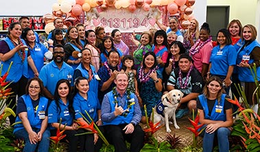 Large group shot of Hilo WalMart employees, Children's Miracle Network and Philanthropy representatives.