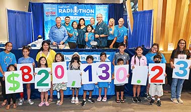 Group shot of Radiothon staff and children.