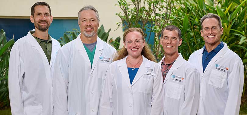 Group shot of physicians in white coats.