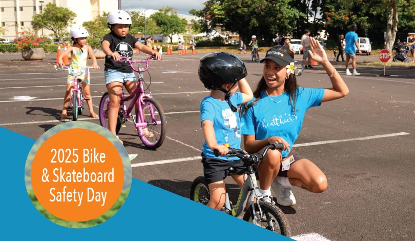 Kids on bikes with adult going for a high five and text overlay 2025 Bike & Skateboard Safety Day.