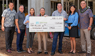 Group shot with giant check for $4 million.