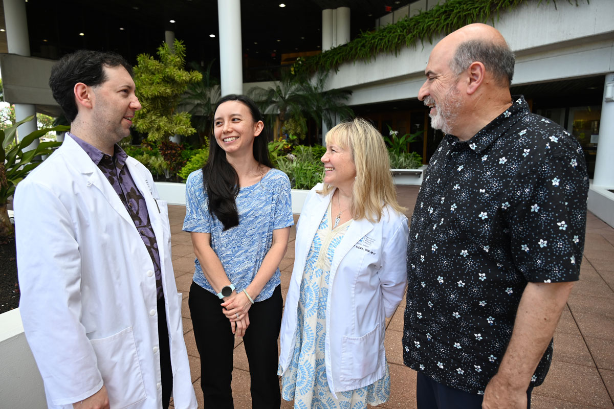 a group of four people talking