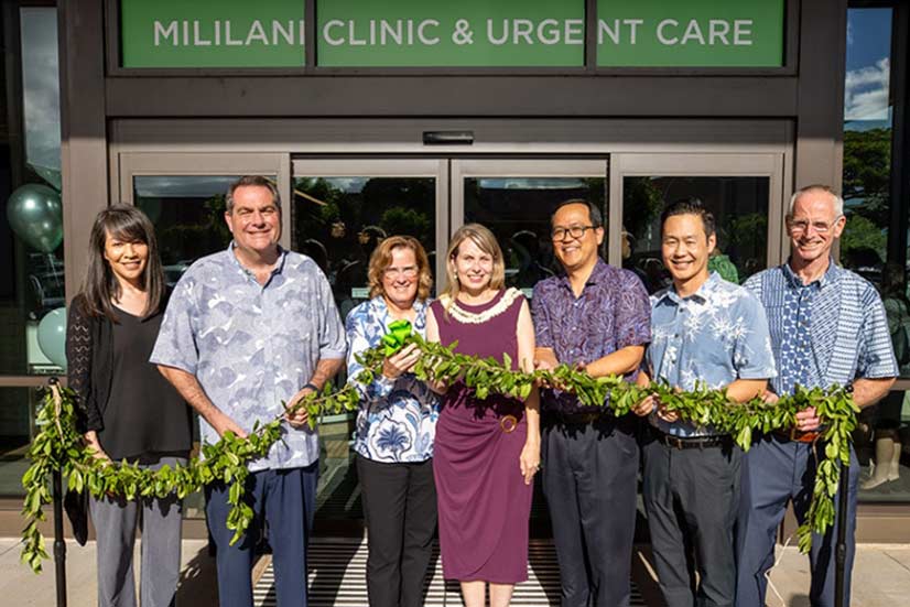 Hawaii Pacific Health leadership holding maile lei at the blessing of a new clinic and urgent care in Mililani.