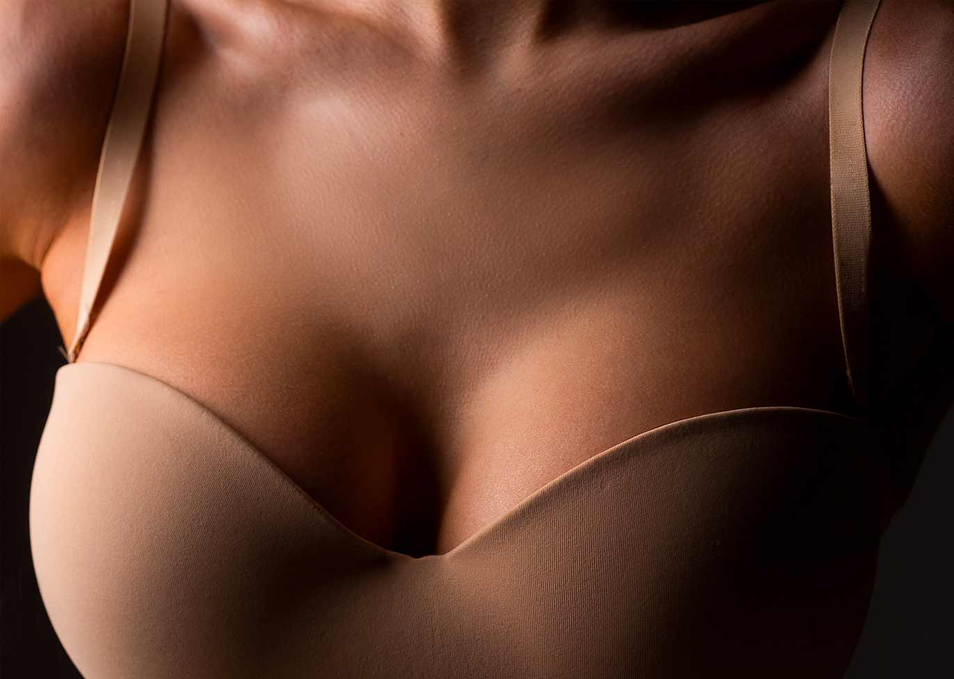 Female in a taupe bra.