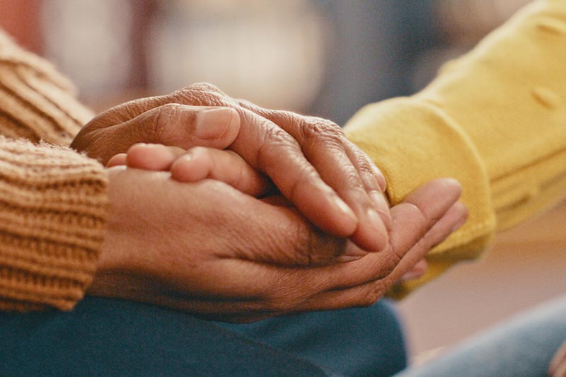 Close up of two hands holding.