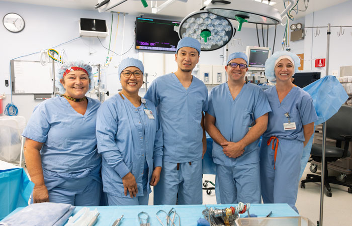 Dr. Hiroo Kinami (center) with members of the Kapiolani Pediatric Heart Center team: Kirsten Thain, surgical technologist; Sherry Viernes, operating room RN; Dr. Eric Boorman, pediatric anesthesiologist; and Justine Hope, perfusionist.