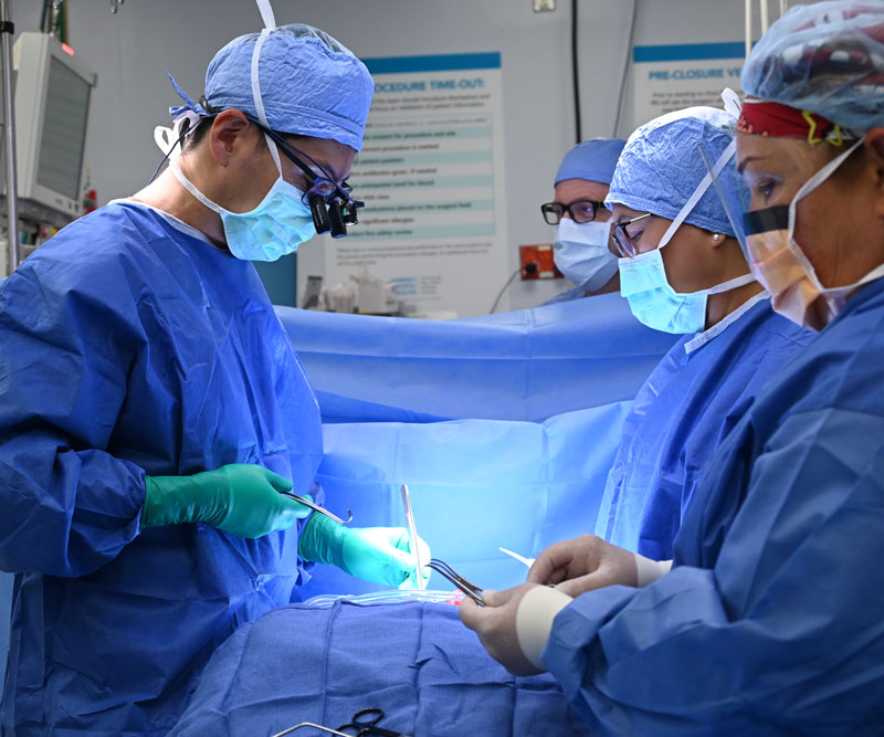 a medical team performs heart surgery