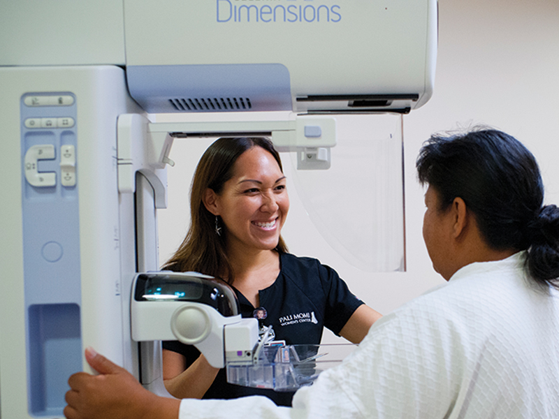 a medical professional and patient  near a machine