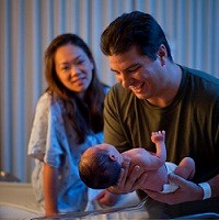 Man holding his new born child
