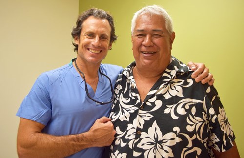 Jeffrey Ano (right) credits his renewed love for ocean sports to Orthopedic Surgeon Dr. David Rovinsky.