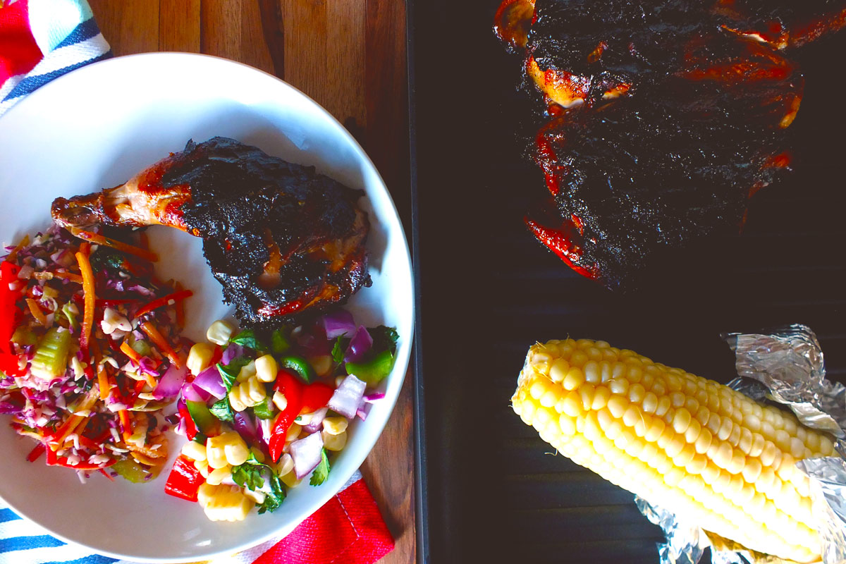 Bowl of Butterflied Cornish Hen with Smoky Balsamic Marinade & Roasted Corn Relish