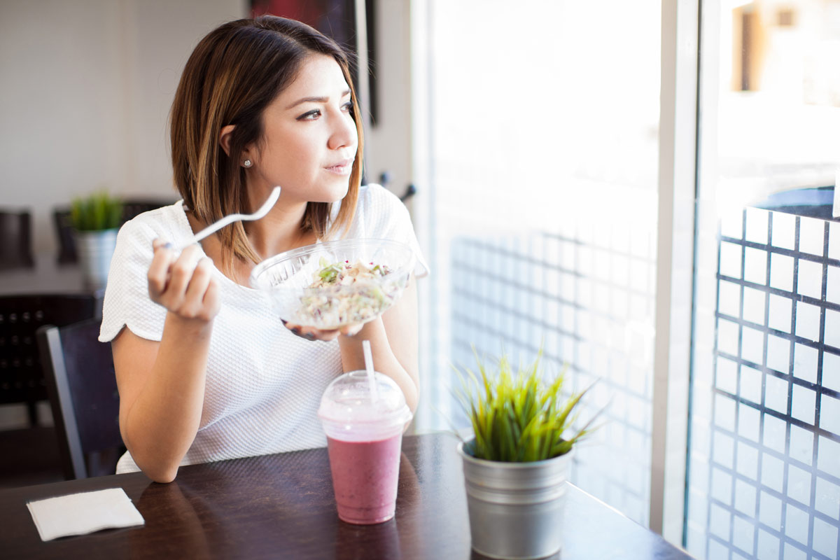 Woman eating a healthy smoothie