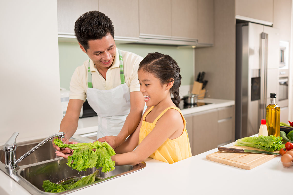 father and daughter preparing bananas