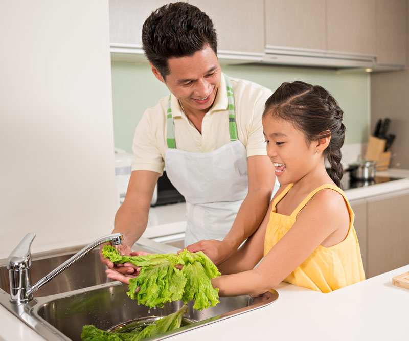 father and daughter preparing bananas