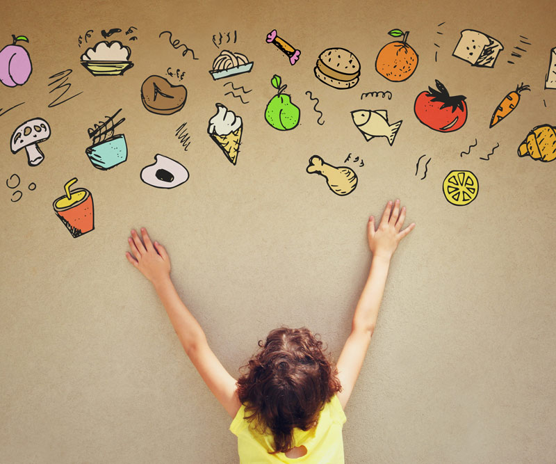 Child reaching out to candies wall art