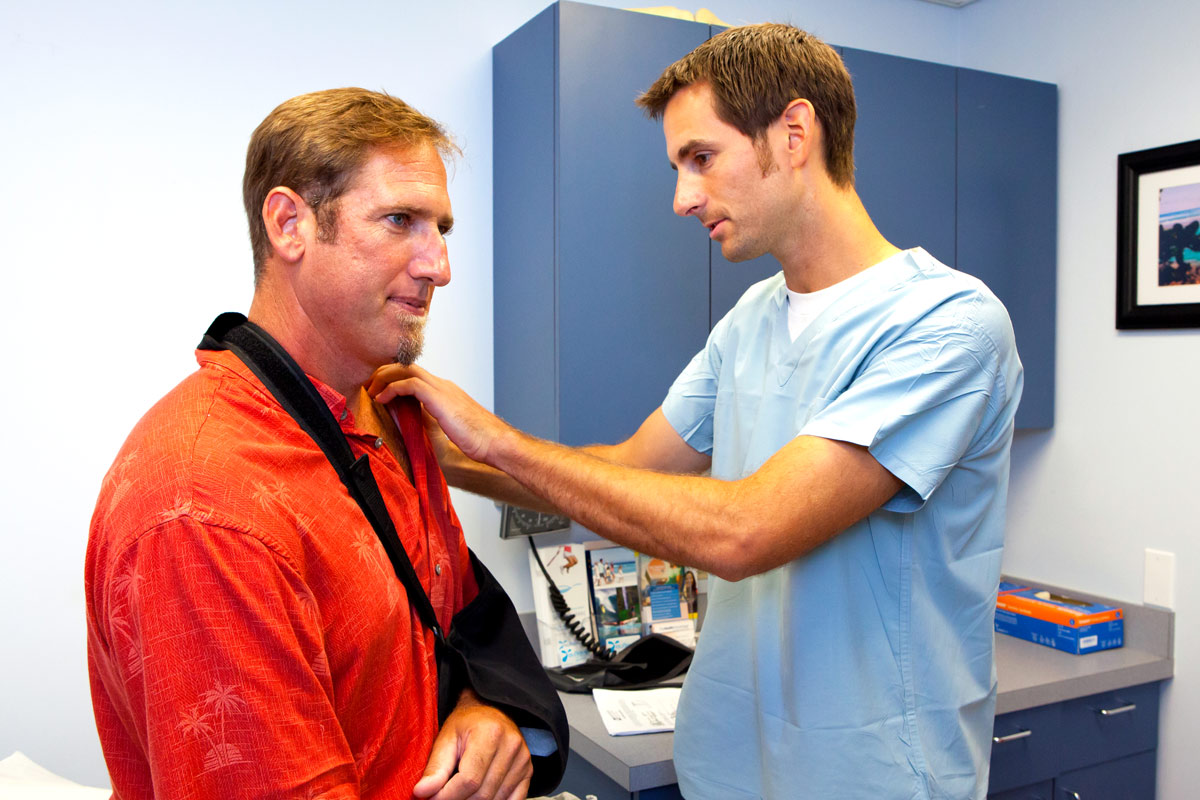 man getting treatment for his dislocated shoulder