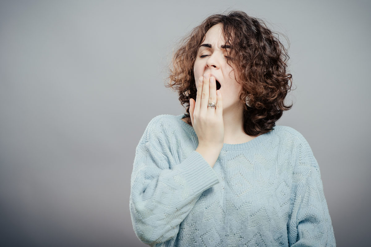 Woman yawning