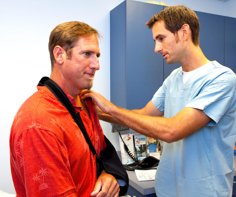 man getting treatment for his dislocated shoulder