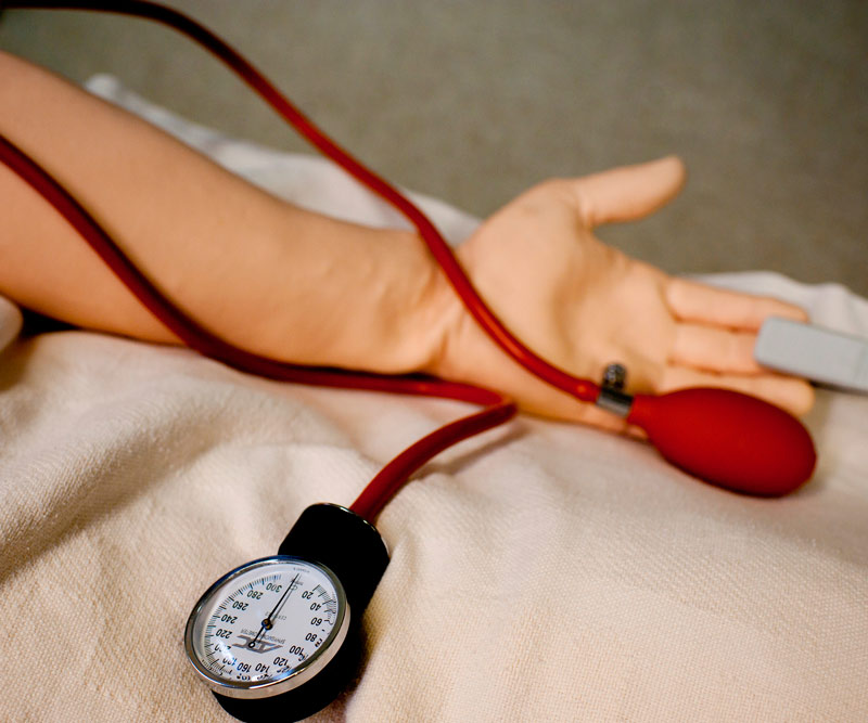 a patient getting their blood pressure checked