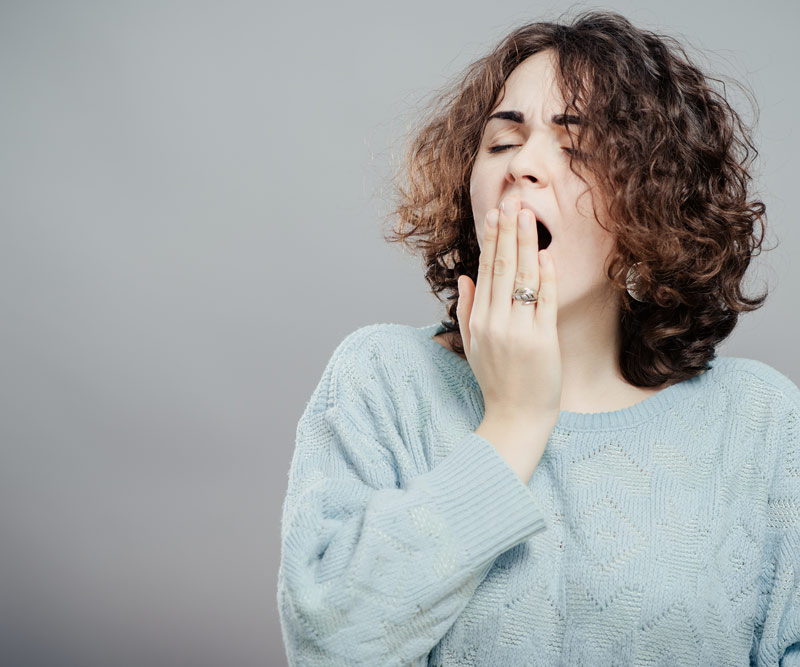 Woman yawning