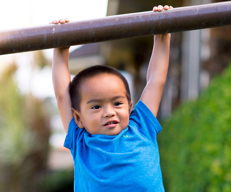 Cam Kaneshiro in climbing gesture