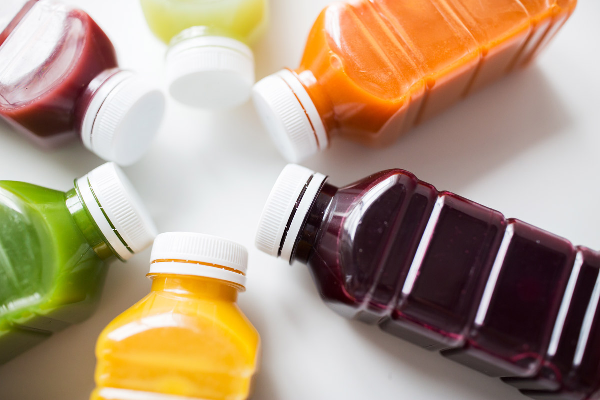 Various colored juice bottles.