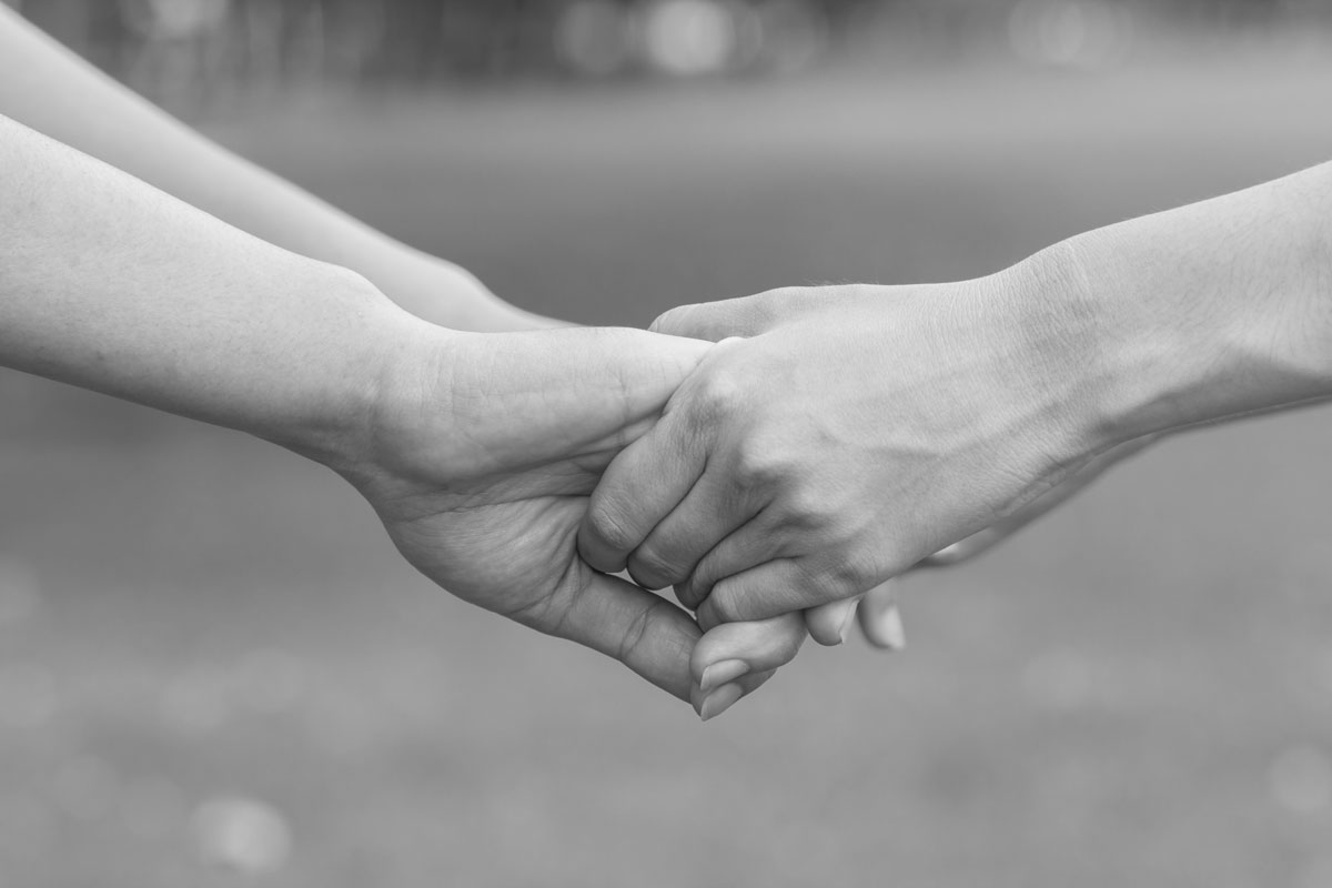 two people holding hands