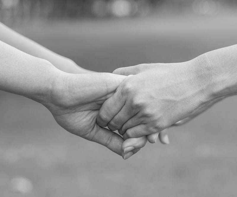 two people holding hands