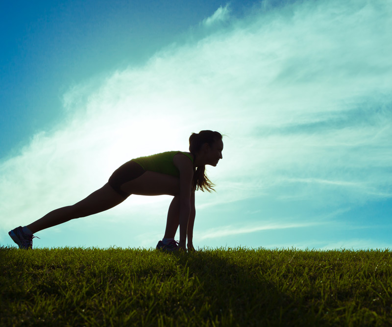 woman stretching before her run