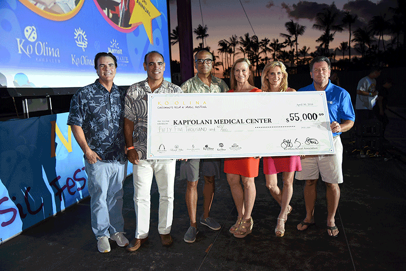 group holding up a check