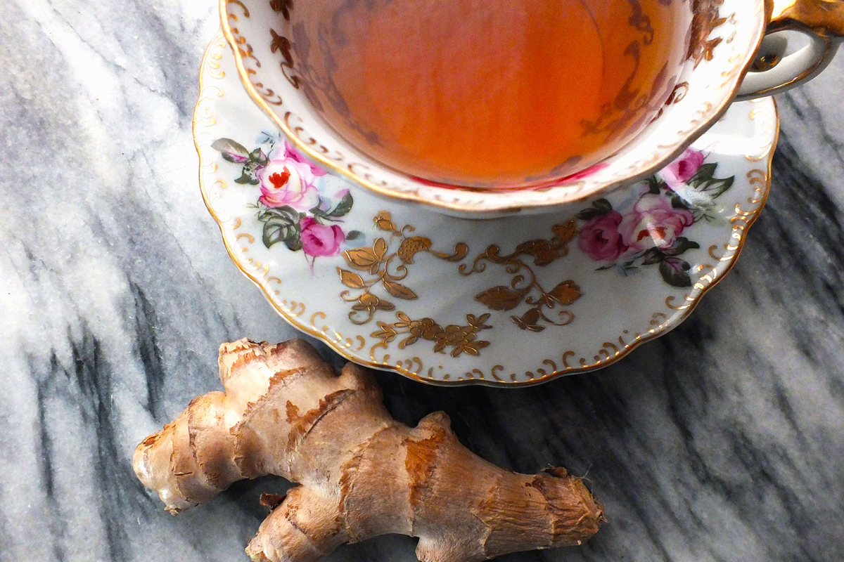 ginger root near a cup of tea