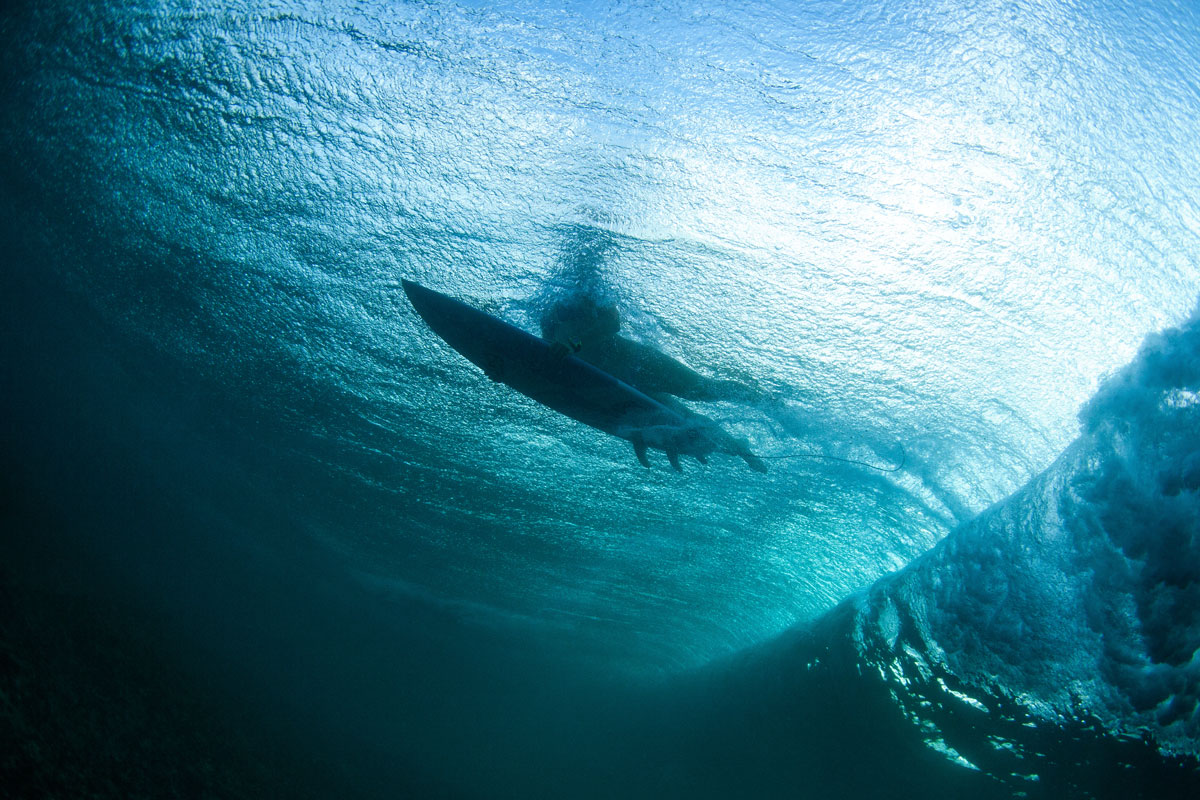 surfer and wave from under the water