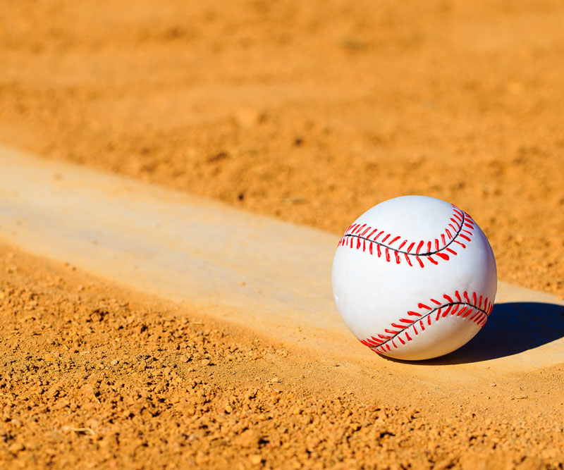baseball alone in the dirt