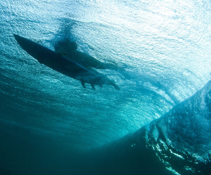 surfer and wave from under the water