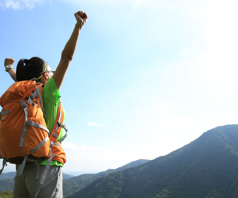 Woman raising her hands in happiness