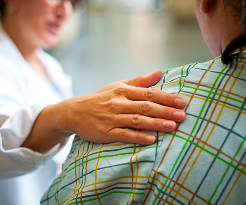 doctor consoling a patient