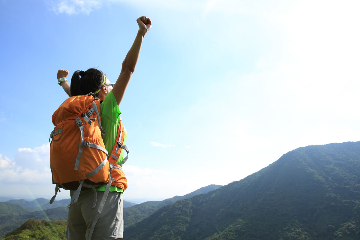 Woman raising her hands in happiness