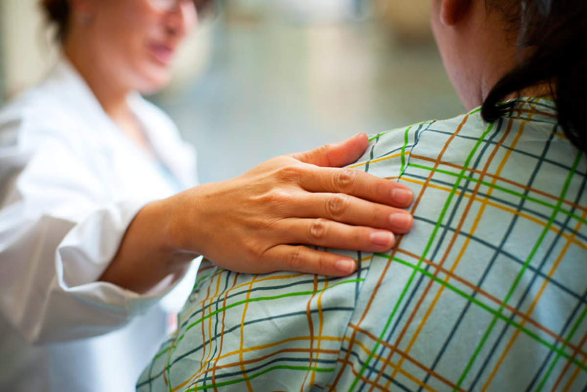 doctor consoling a patient