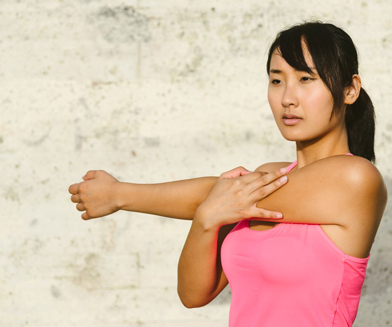 Woman stretching her arm