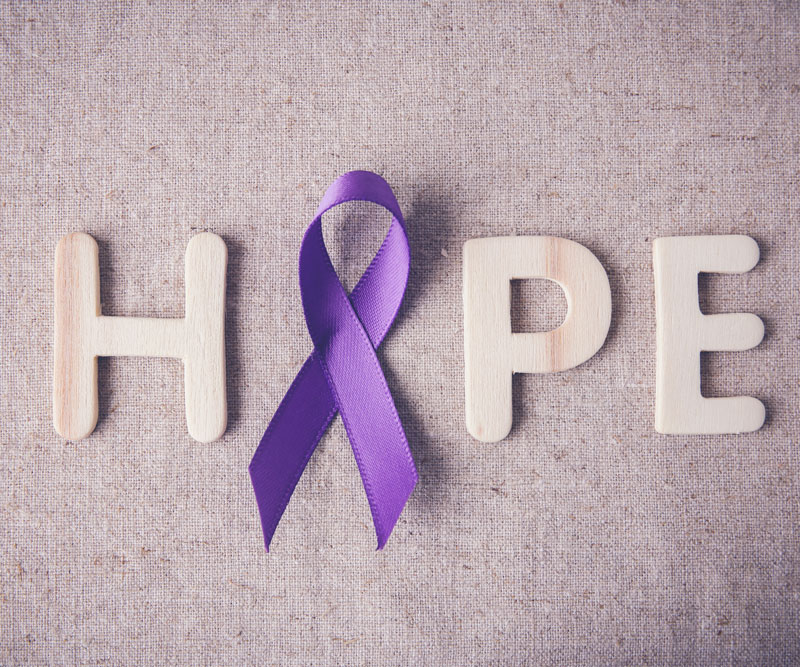 The word hope, with a cancer ribbon