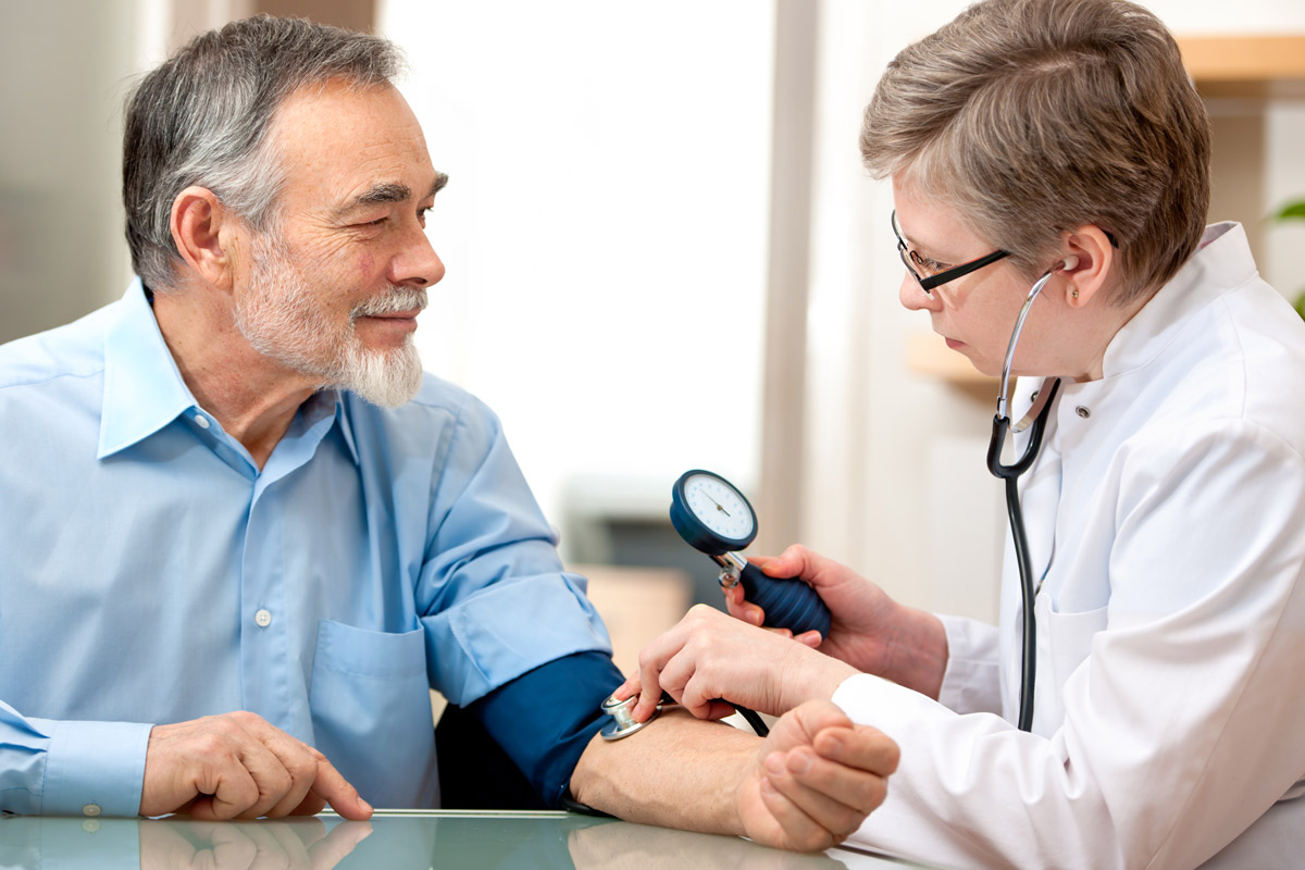 Man getting regular examination from doctor