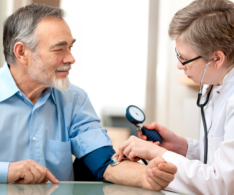 Man getting regular examination from doctor