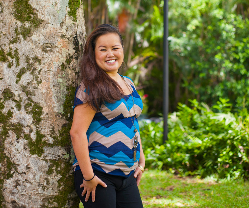 Punahele Carnate standing next to tree