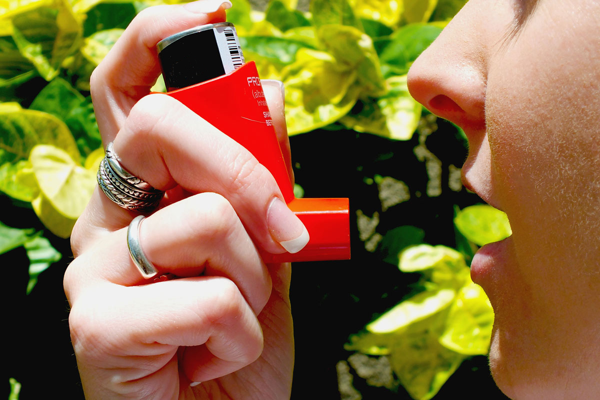 woman using an inhaler