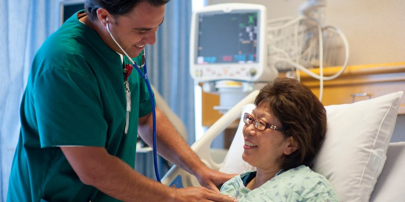 a patient being checked in a hospital bed