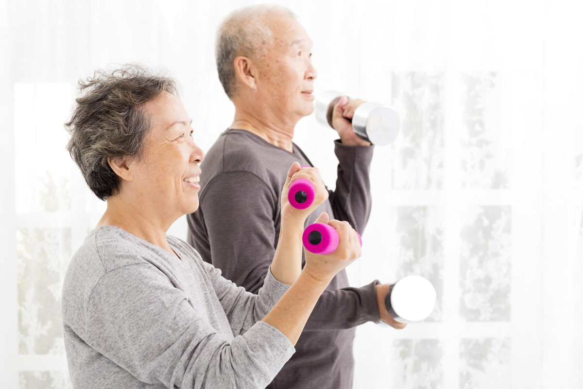 an elderly couple working out together